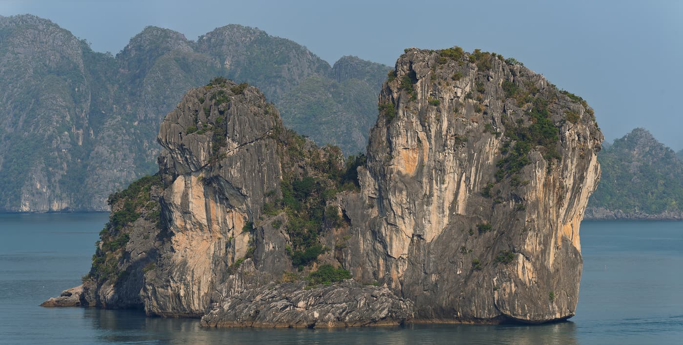 Twin limestone karsts rising out of Ha Long Bay