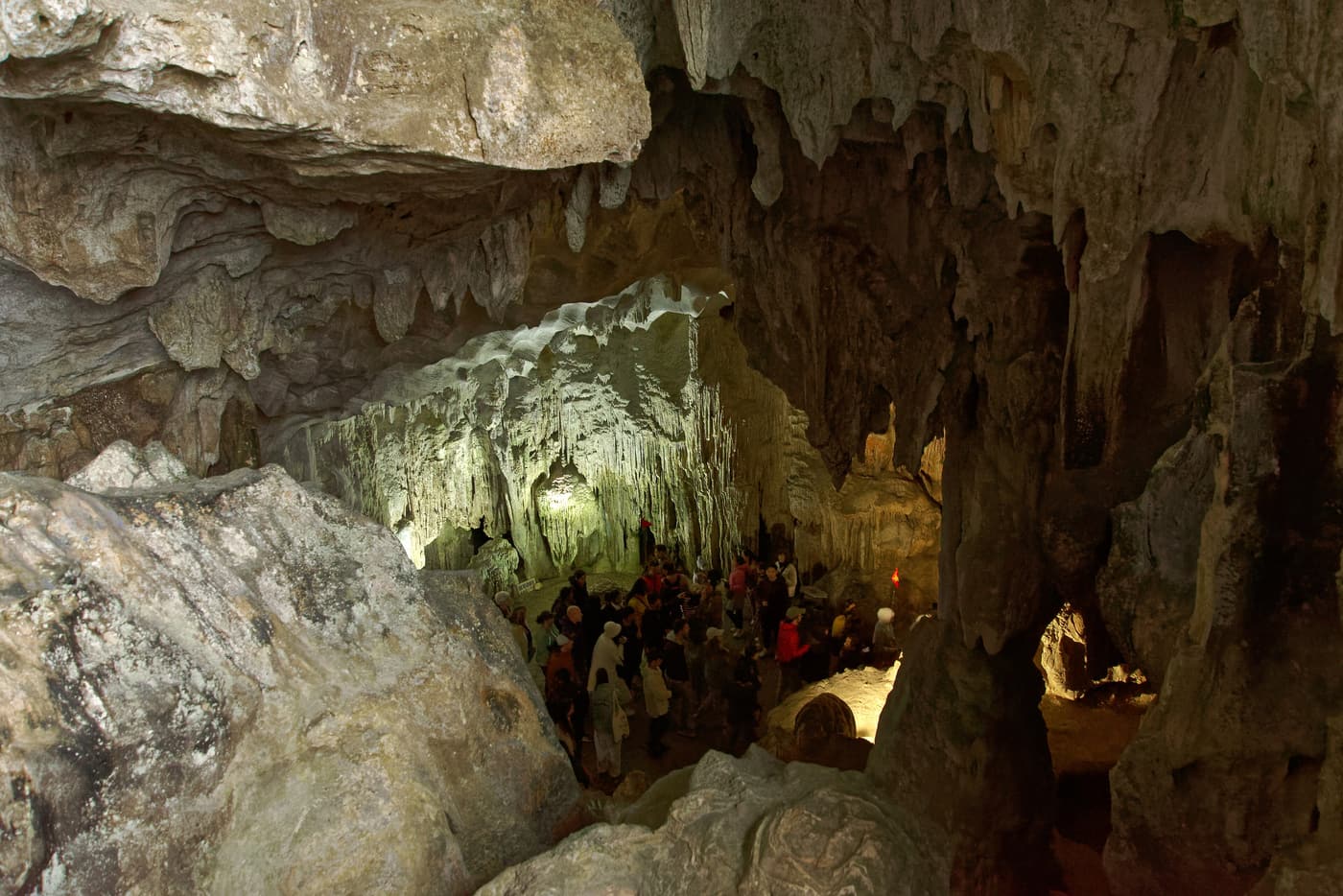 Stalactites lit up inside the vast chambers of Sung Sot cave